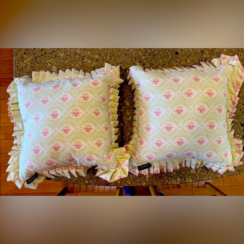 Two decorative pillows; pink & lite green